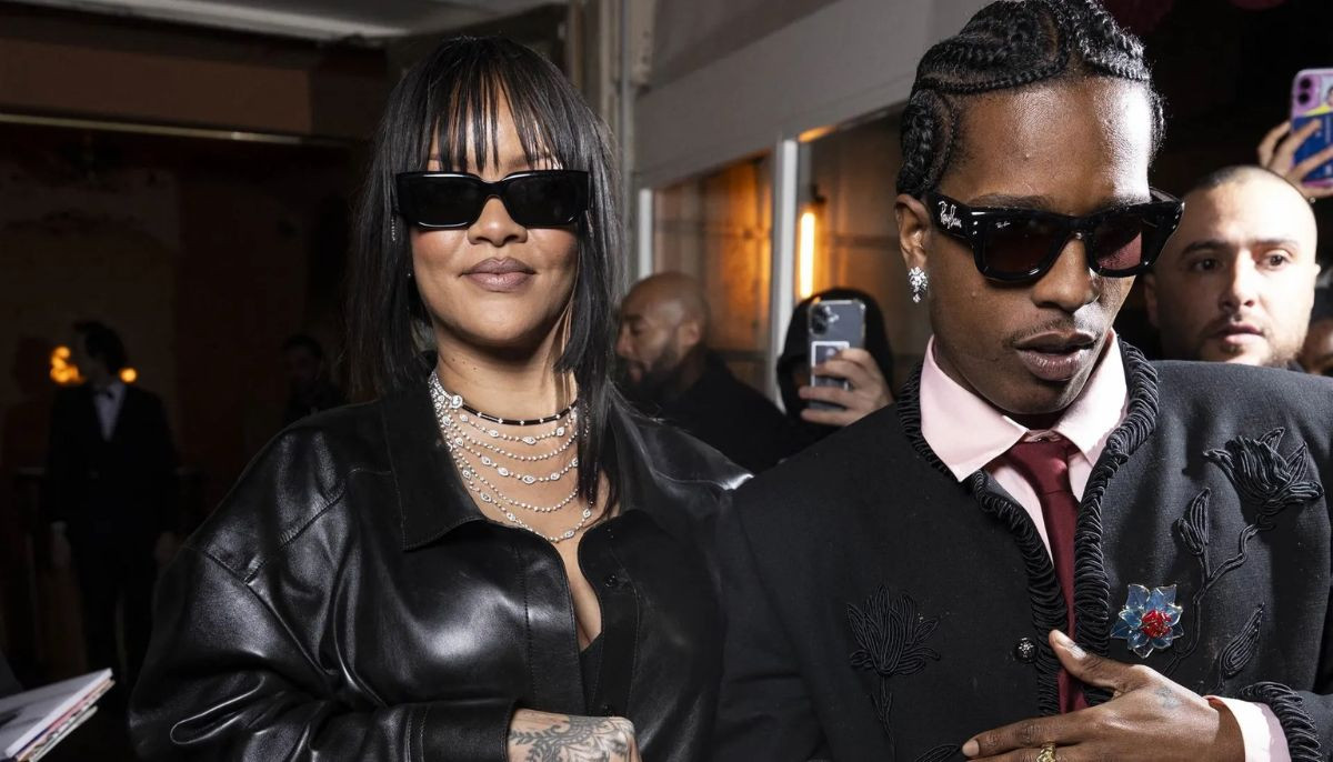 Rihanna elevates Paris Fashion Week look with furry stole, flower earmuffs, and dark shades