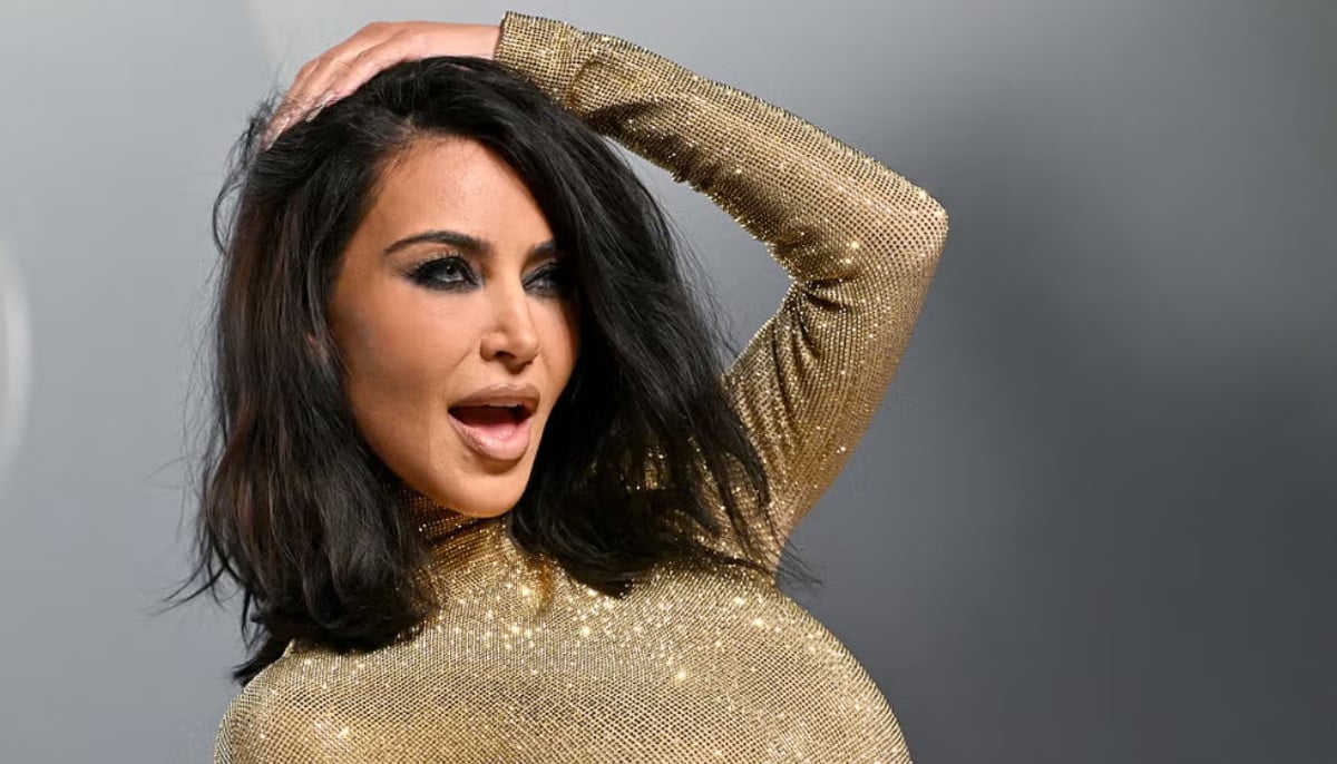 Kim Kardashian stumbles into bush in towering heels before Oscars afterparty