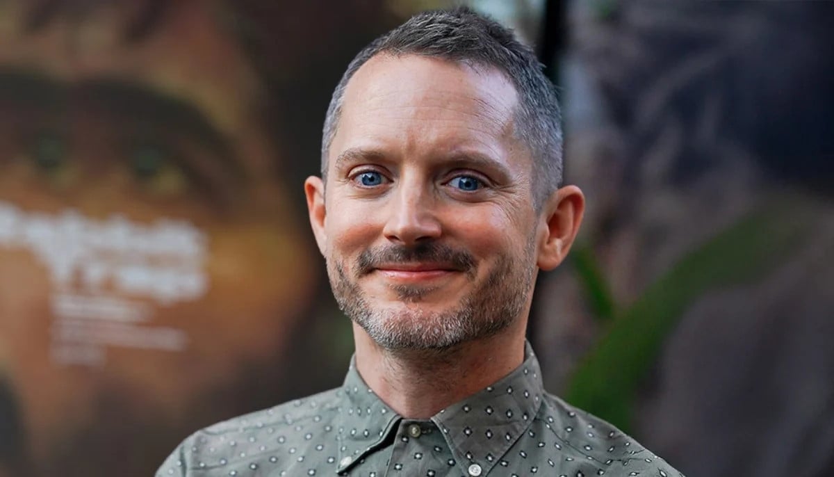 Elijah Wood remembers being a ‘heartbroken executive’ in Paula Abdul’s 1989 music video