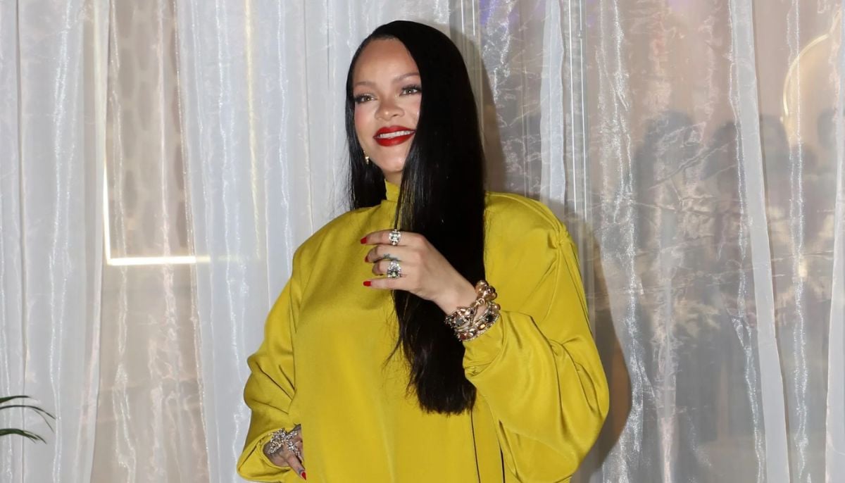 Rihanna gleams in mustard outfit for beauty range launch