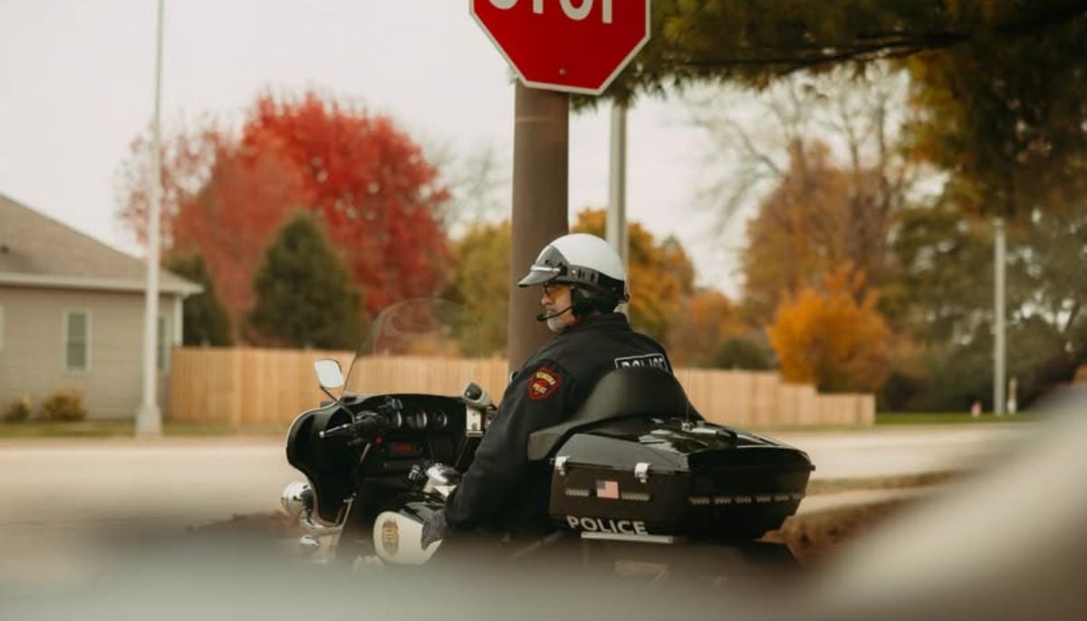 Woman runs stop sign, strikes motorcyclist riding with son: Police