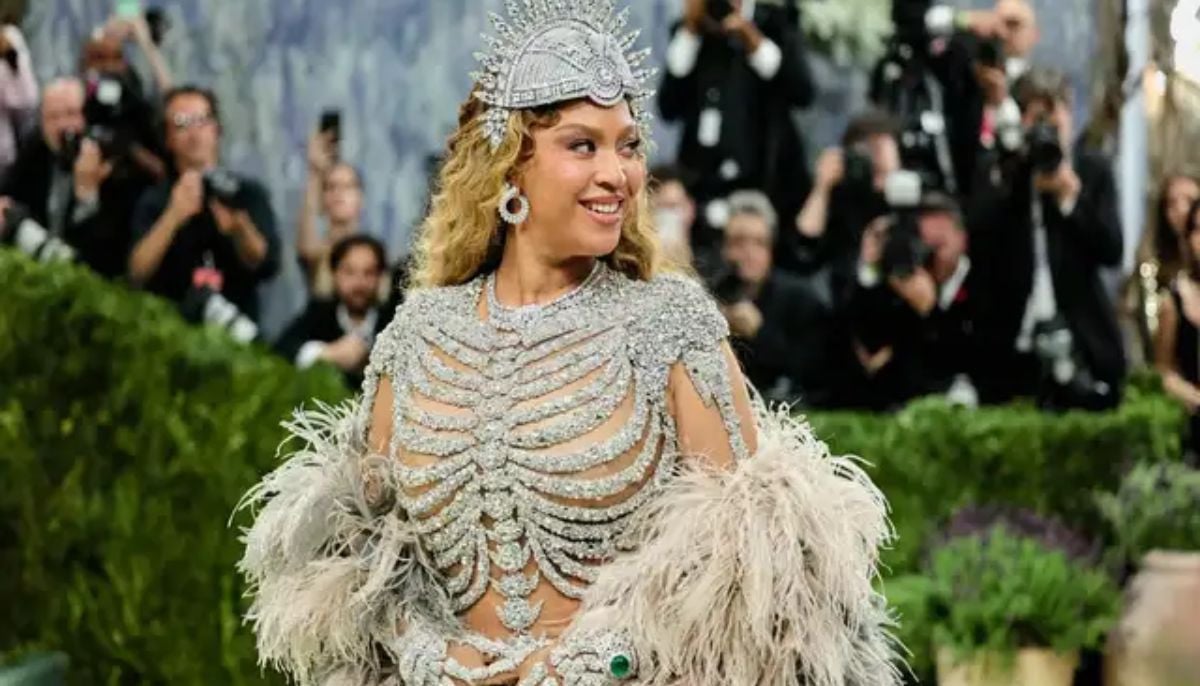 Beyoncé stuns at 2026 Met Gala in sparkling skeleton-inspired nude gown with dramatic feathered cape