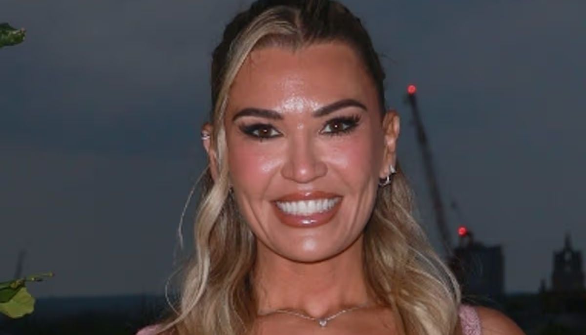 Christine McGuinness almost bursts out of tight corset at showbiz party