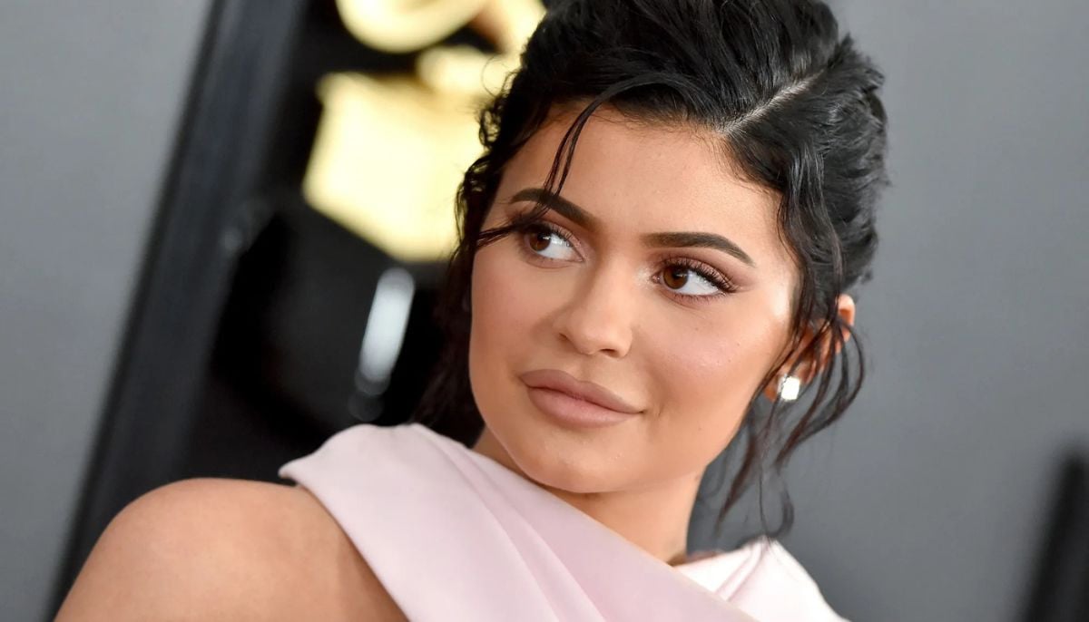 Kylie Jenner&amp;apos;s steamy water-drenched photoshoot for new lip line leaves fans confused