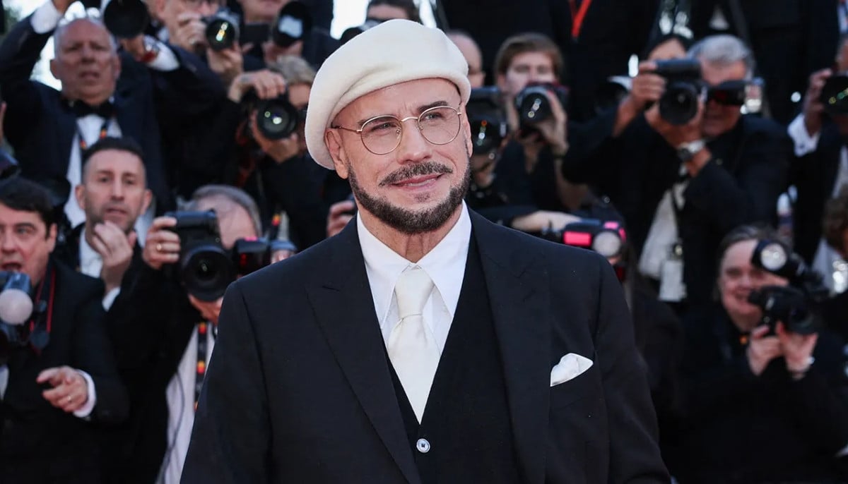 John Travolta reveals why he wore viral berets throughout Cannes debut