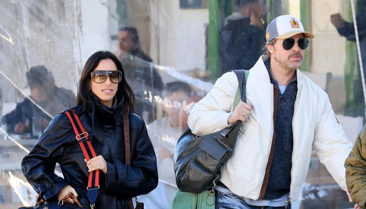 Brad Pitt and Ines de Ramon hold hands at the Mercedes-AMG premiere in Los Angeles