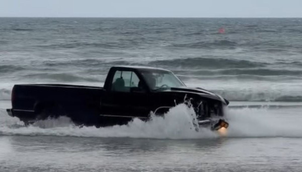 Driver kills beach booth worker before truck plunges straight into the sea 