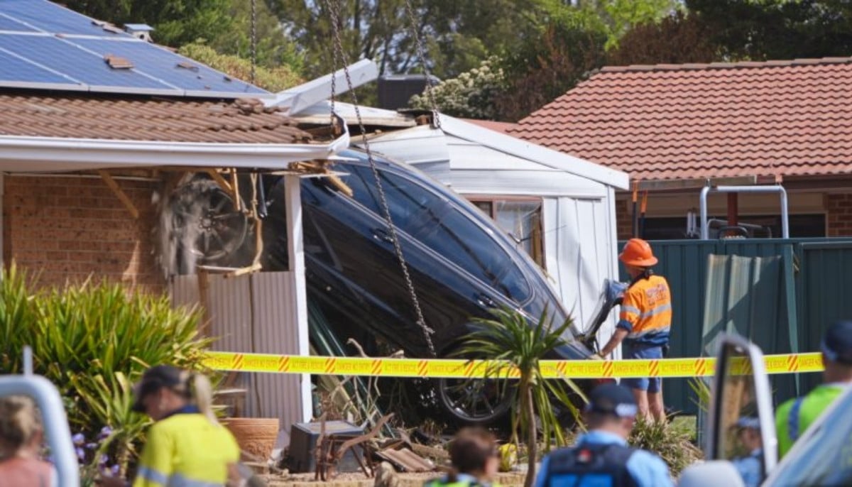 Three teen girls injured after stolen car rolls into Brisbane family home