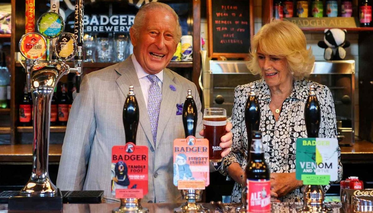 King Charles jokes about drowning sorrows after football loss