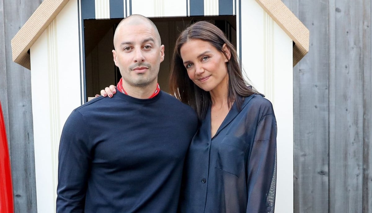 Katie Holmes and artist Jason Bard Yarmosky pose together during Hamptons outing