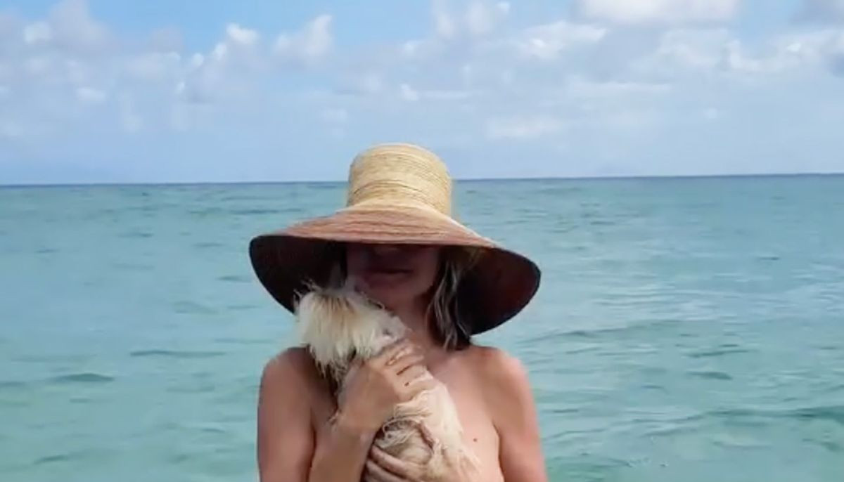 Heidi Klum strips topless during beach holiday with husband