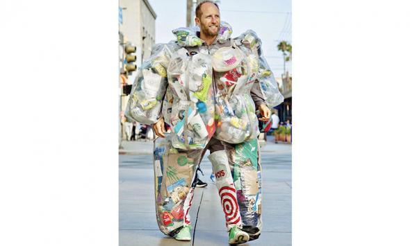 Eco activist spent 30 days wearing his trash – and by the end of the month it weighed 72 lbs