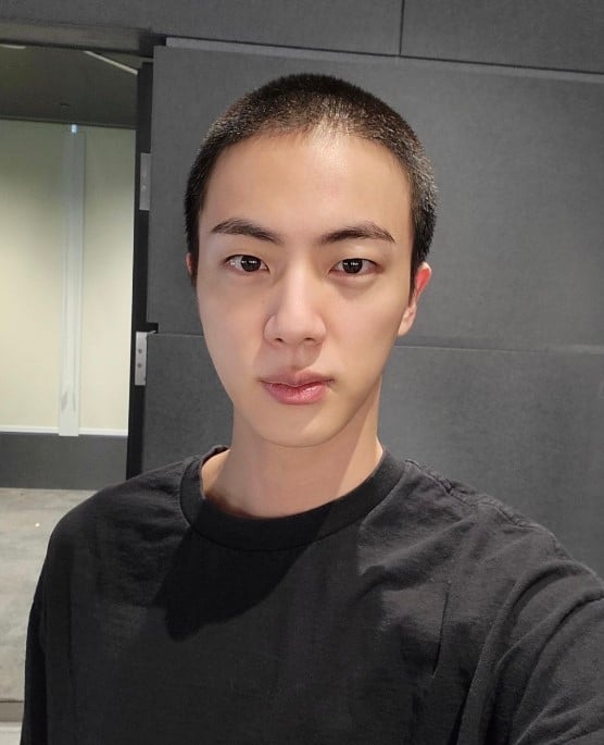 BTS members pose together with Kim Seokjin as he joins military