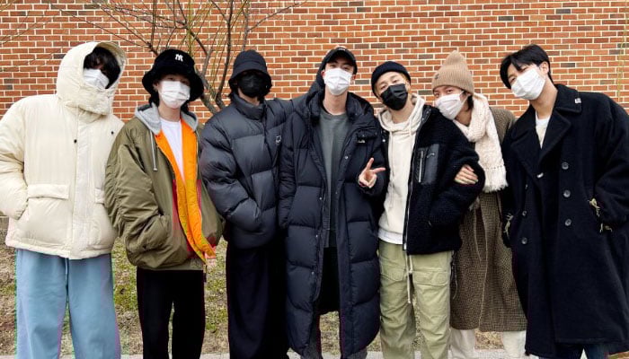BTS members pose together with Kim Seokjin as he joins military