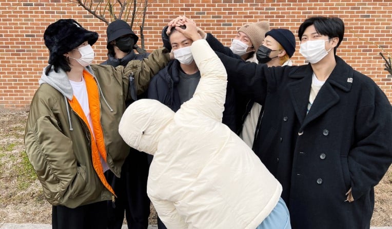 BTS members pose together with Kim Seokjin as he joins military