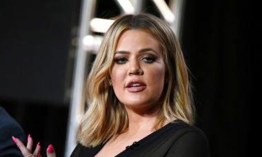 Khloe Kardashian urges fans to 'smile' and  'spread happiness'