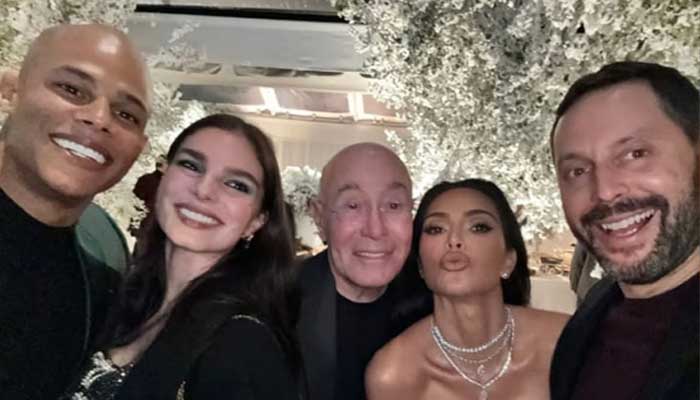 Kim Kardashian enjoys Christmas sledding and sliving in snow with Paris Hilton