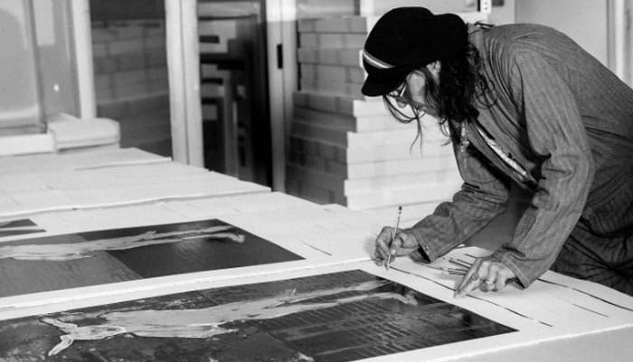 Johnny Depp signs his The Bunnyman artwork with love & appreciation