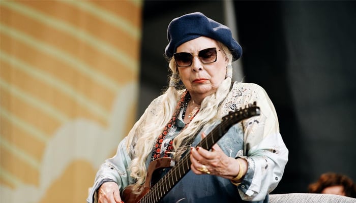 Joni Mitchell gears to perform at the 66th Grammys for the first time