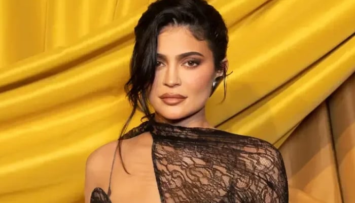 Kylie Jenner turns up the heat in Claudia Schiffers red Chanel bikini