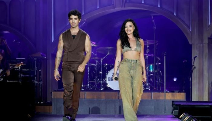 Joe Jonas, Demi Lovato sparkle on stage despite complicated history