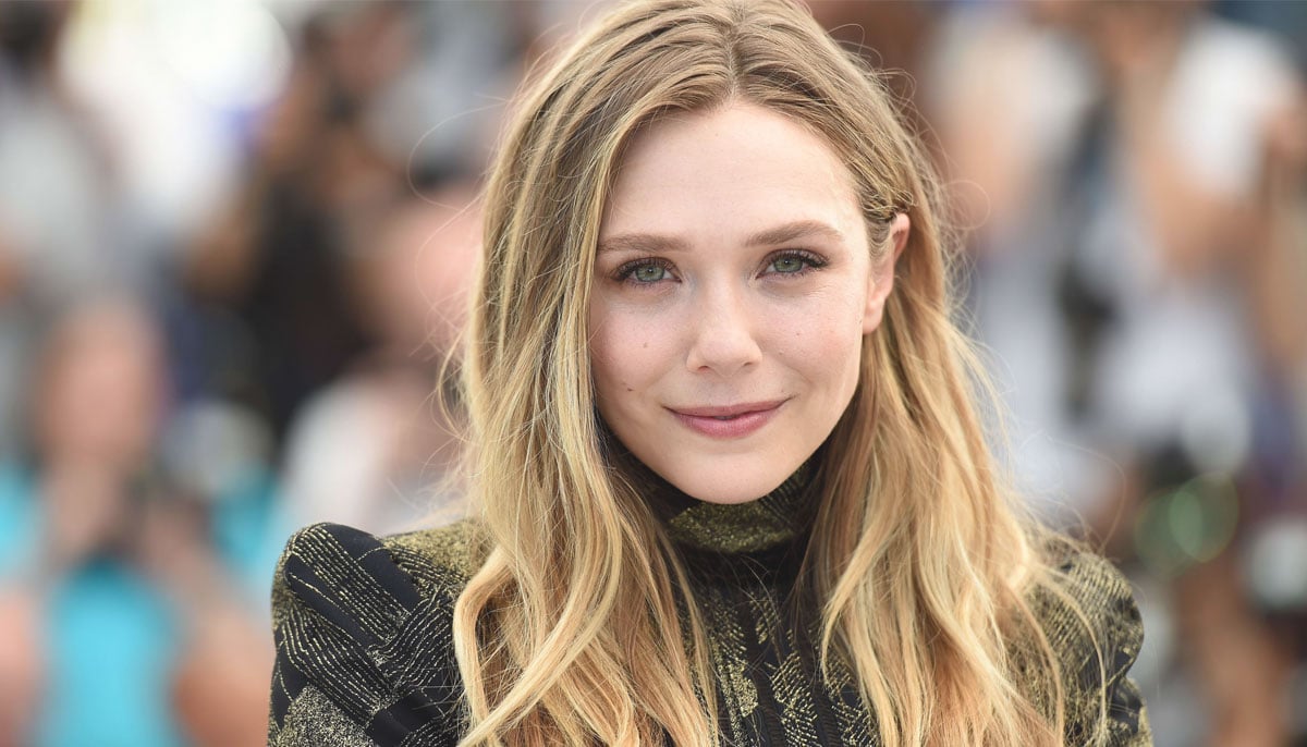 Elizabeth Olsen rocks in Givenchys bold office look at Eternity screening