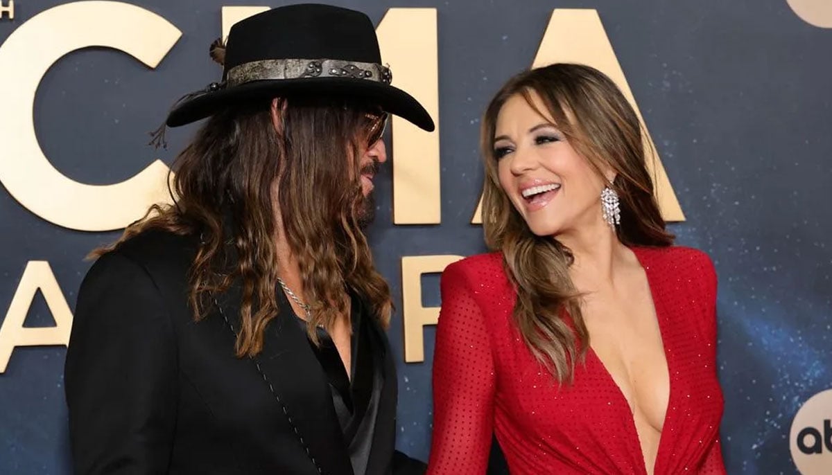 Elizabeth Hurley steals the show in red hot look while attending CMA Awards with Billy Ray Cyrus