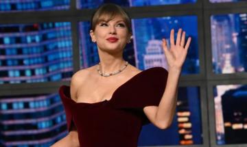 Taylor Swift turns heads in burgundy velvet look during new late night appearance