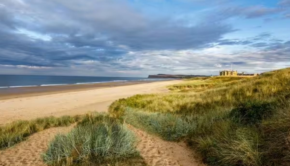 Police rush to scene after woman found dead on UK beach