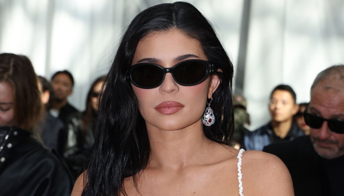 Kylie Jenner strips it back to a bikini and a statement locket