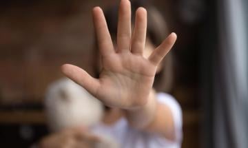 School badge leads to identification of child in sex abuse videos