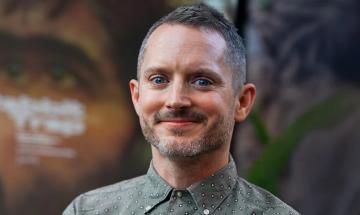 Elijah Wood remembers being a ‘heartbroken executive’ in Paula Abdul’s 1989 music video