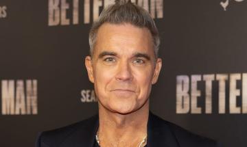 Robbie Williams turns to AI for help with writing amid post-concert controversy