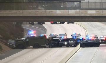 Police run over gunman with armoured vehicle following fatal shooting