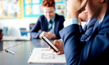UK government introduces statutory ban on mobile phones in English schools