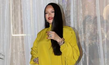 Rihanna gleams in mustard outfit for beauty range launch