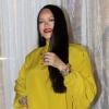 Rihanna gleams in mustard outfit for beauty range launch