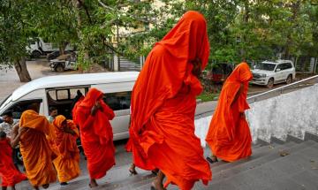 22 monks detained at airport in historic drug bust