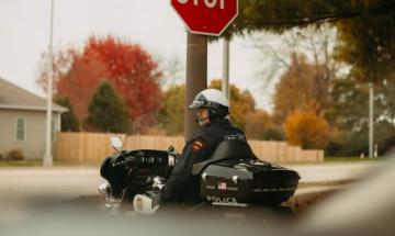 Woman runs stop sign, strikes motorcyclist riding with son: Police