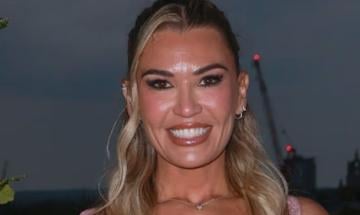 Christine McGuinness almost bursts out of tight corset at showbiz party