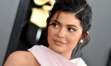 Kylie Jenner's steamy water-drenched photoshoot for new lip line leaves fans confused