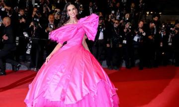 Demi Moore dazzles in pink bow gown as stars light up Cannes red carpet