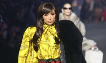 Paris Hilton debuts shocking dark hair transformation during Gucci runway appearance