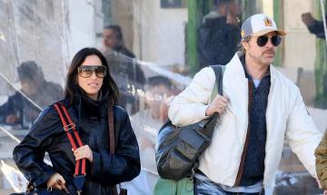 Brad Pitt and Ines de Ramon hold hands at the Mercedes-AMG premiere in Los Angeles