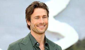 Glen Powell recalls bizarre fan who eats photos of his face every day