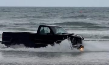 Driver kills beach booth worker before truck plunges straight into the sea 
