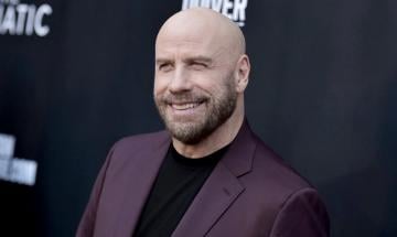 John Travolta thanks fans after Propeller One-Way Night Coach hits no. 1 globally
