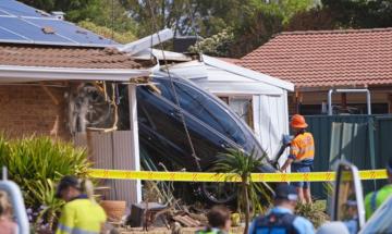 Three teen girls injured after stolen car rolls into Brisbane family home
