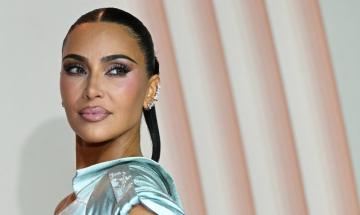 Kim Kardashian gives Will Ferrell a crash course in selfies