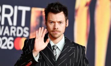 Harry Styles dances and blows kisses to crowd during London concert performance
